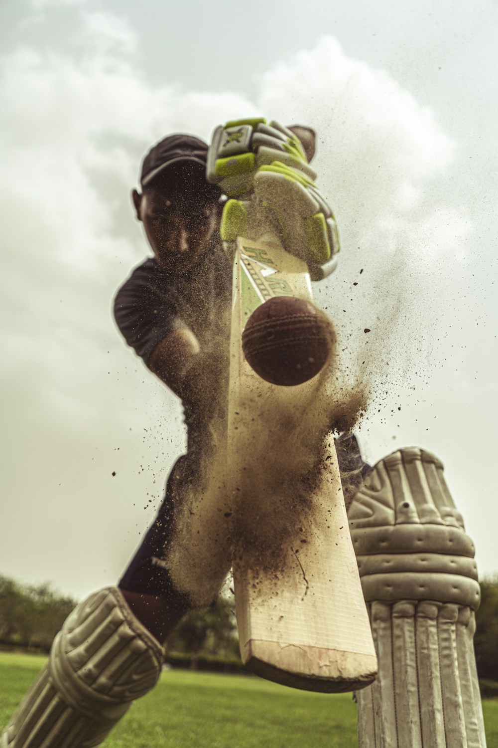 Cricket ball caught in wicket-keeper's gloves